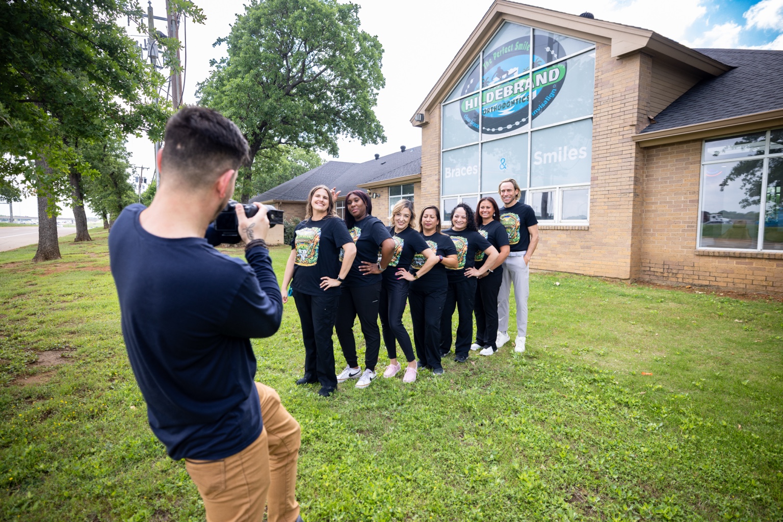Josh Lewis photographing a dental practice team on location