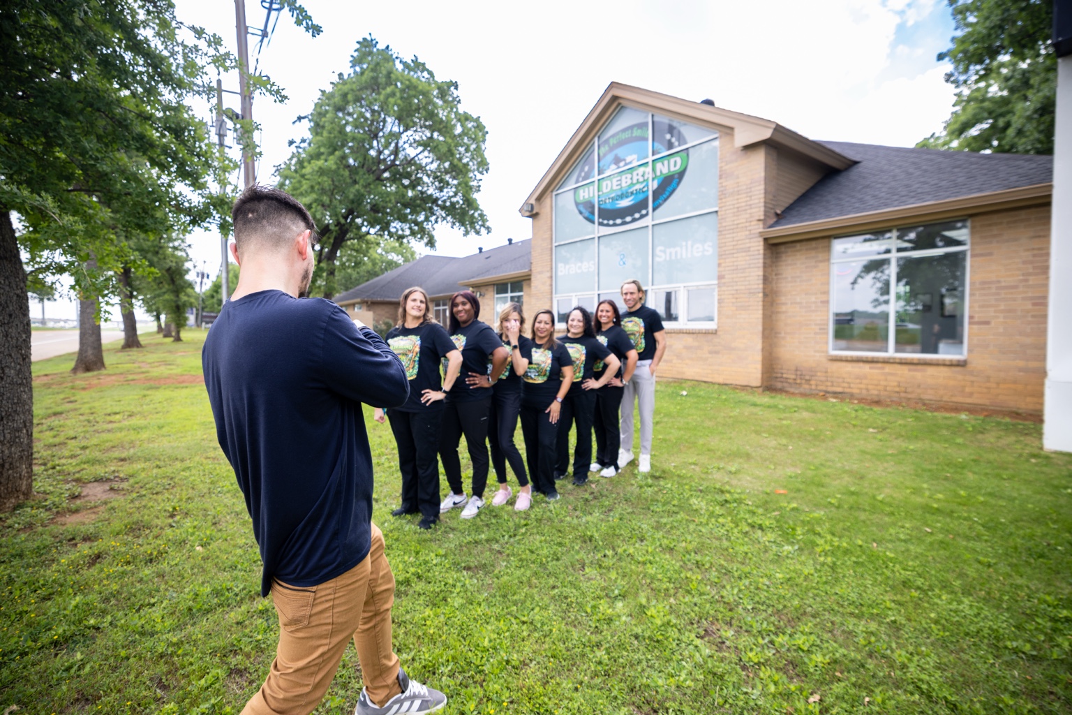 Josh Lewis directing an on-location dental practice photo session