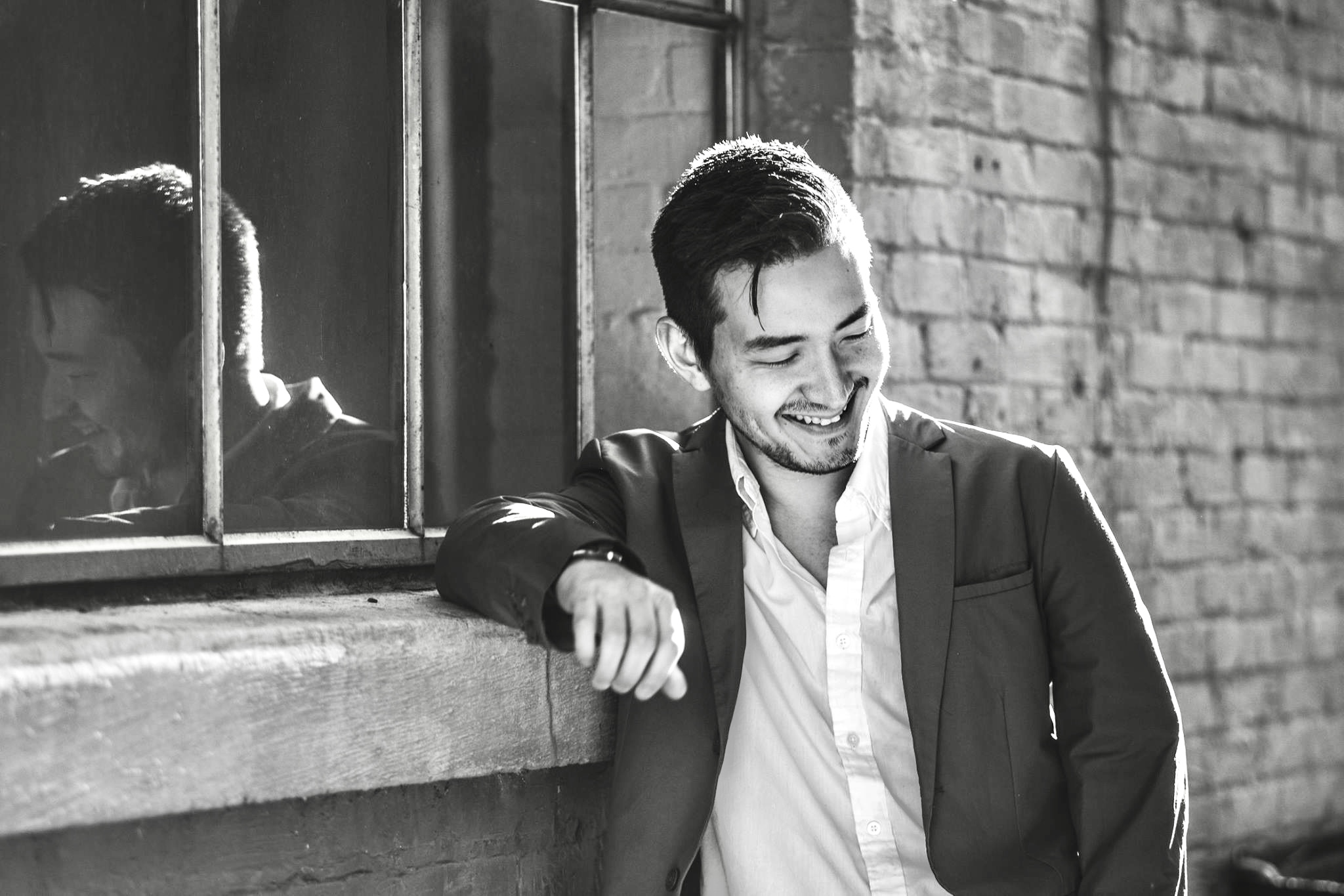 Black-and-white editorial portrait of Josh Lewis